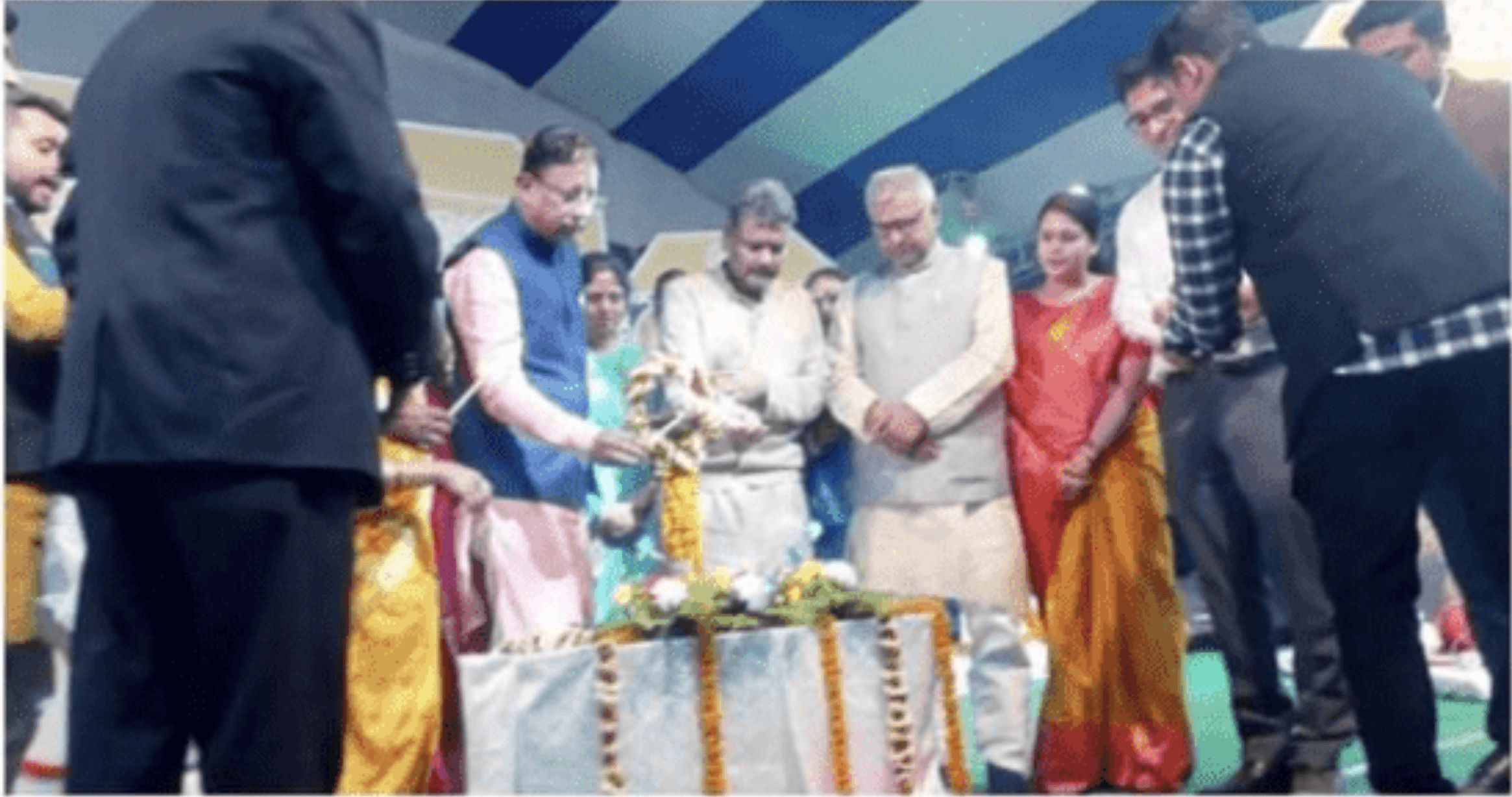 People lighting the candle at event.